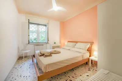 Letto o letti in una camera di Casa Spaziosa, a pochi passi da Metro e Centro
