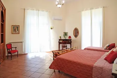 Letto o letti in una camera di Mariù's sweet home
