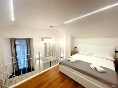 Letto o letti in una camera di Dante Alighieri Suite