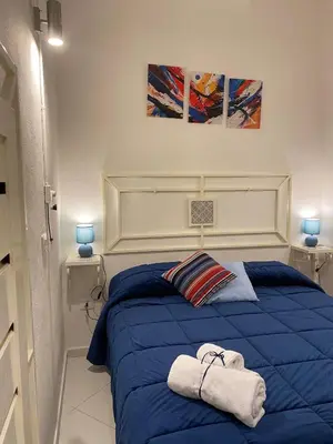 Letto o letti in una camera di I Rifugi Blu e Sole di Neapolis Teatro Antico