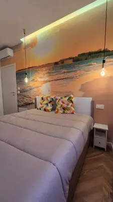 Letto o letti in una camera di B&B AllegriaNapoletana
