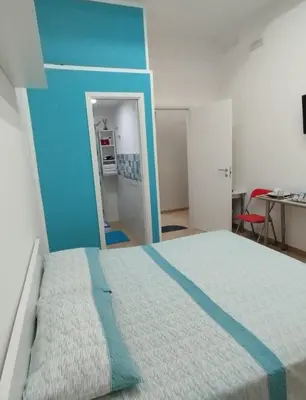 Letto o letti in una camera di Stanza centrale