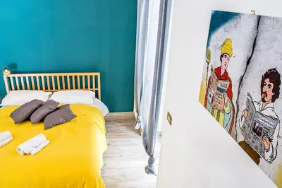 Letto o letti in una camera di Napoli Connect Guesthouse