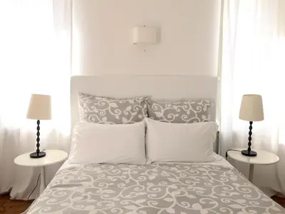 Letto o letti in una camera di Relais Piazza dei Martiri