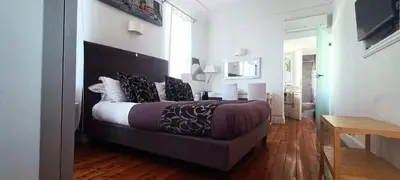 Letto o letti in una camera di Relais Piazza dei Martiri