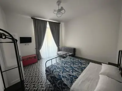 Letto o letti in una camera di Domus Archivii