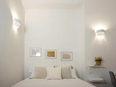 Letto o letti in una camera di UniHome Napoli