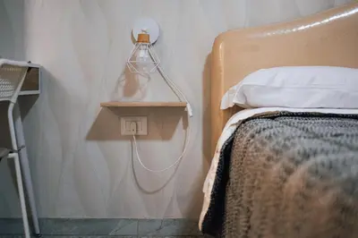 Letto o letti in una camera di Dimora Luciella history and culture