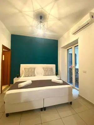 Letto o letti in una camera di B&B Napoli Duomo