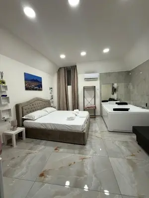 Letto o letti in una camera di Valentino Suite 36