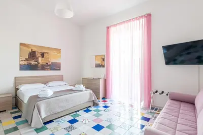 Letto o letti in una camera di Appartamenti La Dimora di Parthenope Centro Storico