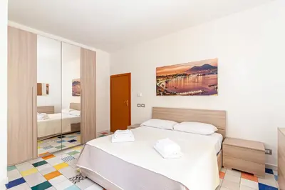Letto o letti in una camera di Appartamenti La Dimora di Parthenope Centro Storico