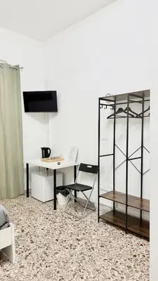 TV o dispositivi per l'intrattenimento presso House Corso Umberto Rooms & Comfort by Loveinthetravel
