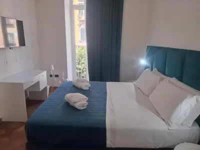 Letto o letti in una camera di Neapolis Apartment Angioino