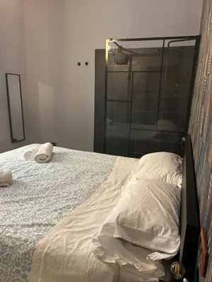 Letto o letti in una camera di suite di Peppe Napoli Centro