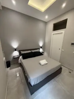 Letto o letti in una camera di La Casita Napoli Rooms