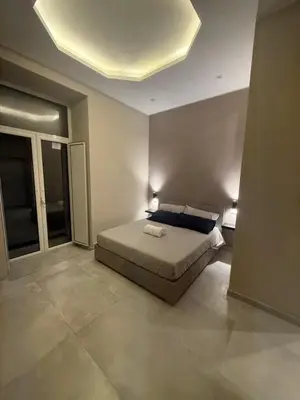 Letto o letti in una camera di La Casita Napoli Rooms