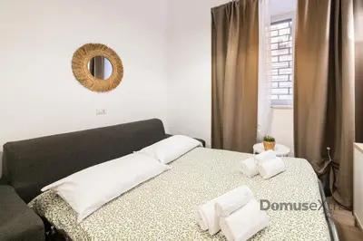 Letto o letti in una camera di Superior Holiday House Napoli By DomusExtra