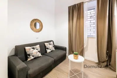 Area soggiorno di Superior Holiday House Napoli By DomusExtra