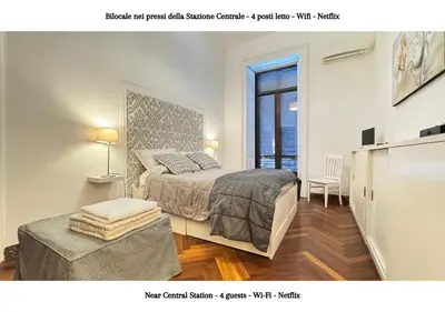 Letto o letti in una camera di STAZIONE CENTRALE - 4 posti letto con wifi e netflix a Piazza Garibaldi