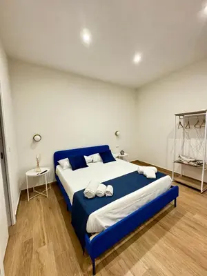 Letto o letti in una camera di Neapolitan Suites