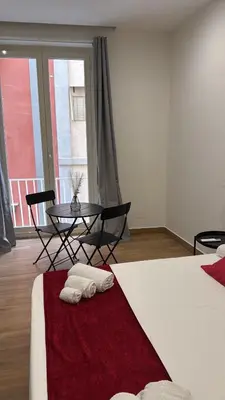 Letto o letti in una camera di Neapolitan Suites