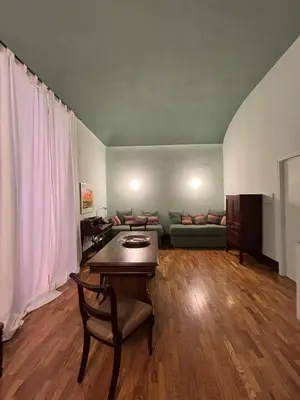 Area soggiorno di Rosso Napoli Suites