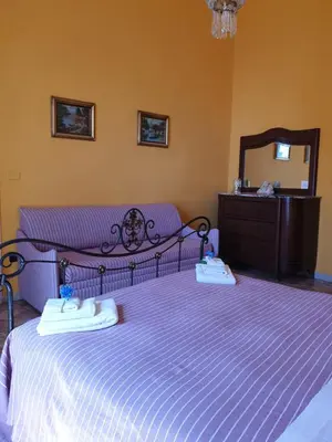 Letto o letti in una camera di A Casa di Mamma