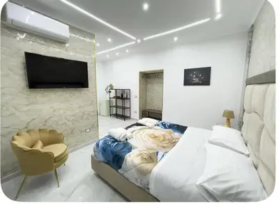 Letto o letti in una camera di B&B luxury house gold