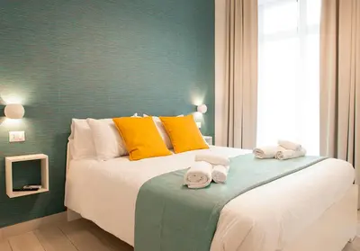 Letto o letti in una camera di MIGLIO SACRO Suites