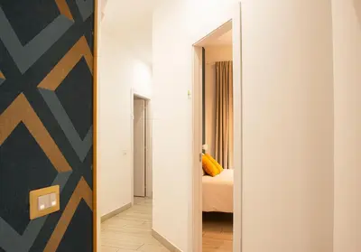 Letto o letti in una camera di MIGLIO SACRO Suites