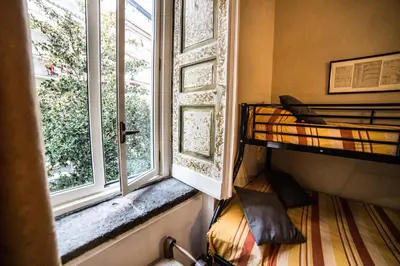 Letto o letti in una camera di Palazzo Argentino