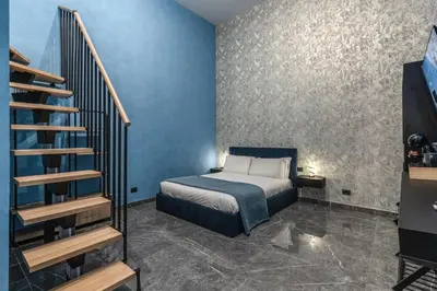 Letto o letti in una camera di Dimora Napoli Centrale