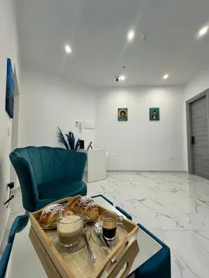 Area soggiorno di Posty's Suite