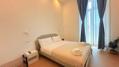 Letto o letti in una camera di Izz Home