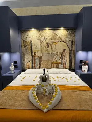 Letto o letti in una camera di Odeon Neapolis - Historic Suites in Roman Theater