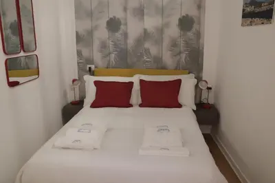 Letto o letti in una camera di La Gioia di Napoli apartment & studios