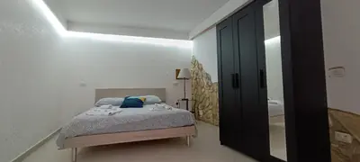 Letto o letti in una camera di Basso Home a Spaccanapoli