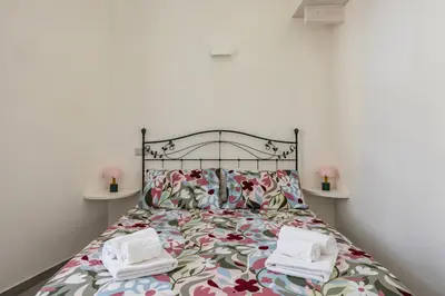 Letto o letti in una camera di Holme Relais Santa Lucia by NapoliApartments