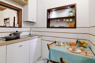 Cucina o angolo cottura di Plebiscito Apartment by Ele