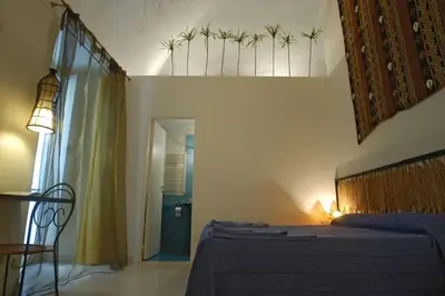 Letto o letti in una camera di diLetto a Napoli