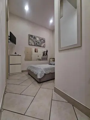 Letto o letti in una camera di Aurora's house Materdei