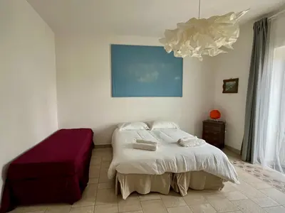 Letto o letti in una camera di SANTA MADRE NAPOLI penthouse