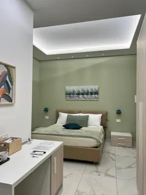 Letto o letti in una camera di B&B Nanu Napoli centro
