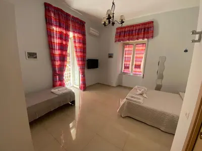 Letto o letti in una camera di Dimora Melania