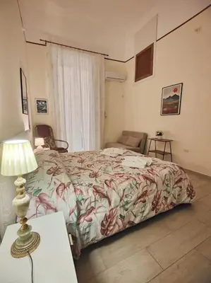 Letto o letti in una camera di Neathea Napoli