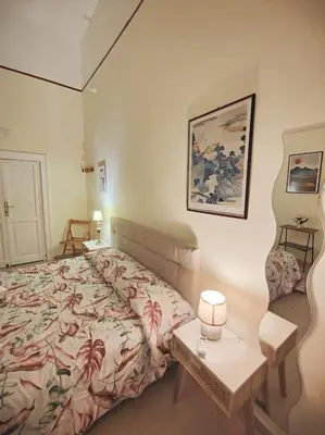 Letto o letti in una camera di Neathea Napoli