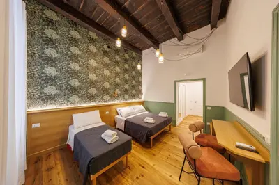 TV o dispositivi per l'intrattenimento presso The Tribunali Apartments - Entire Apt - By HouseinNaples