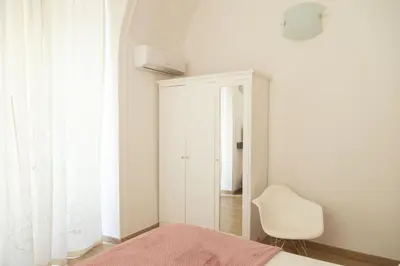 Letto o letti in una camera di Totò Style Apartment