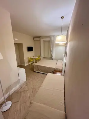 Letto o letti in una camera di de Ribera rooms in Naples